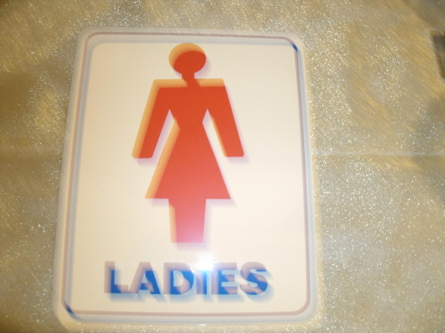 Ladies Bathroom Sign. Self Stick. New. 6" W X 7 1/2" H.