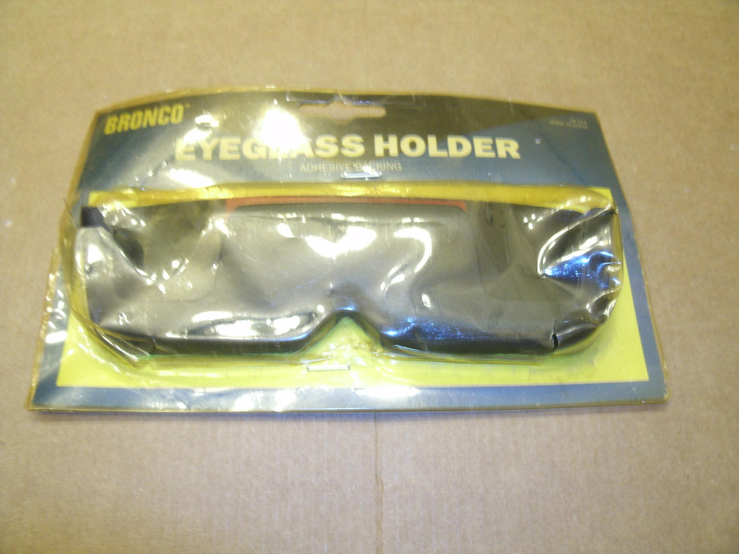 Bronco CR-572 Eyeglass Holder With Adhesise Backing. CR-572.