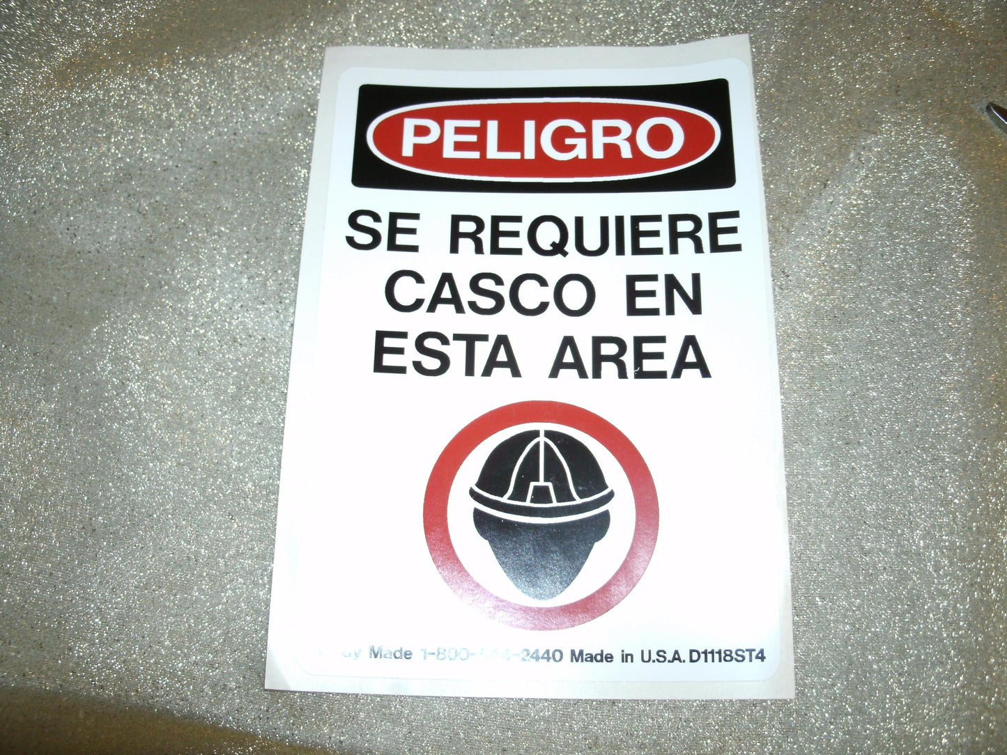 Peligro Se Requiere Casco En Esta Area Sign. Spanish. New.