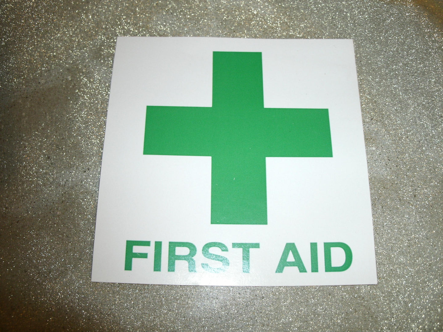First Aid Sign. Vinyl Sticker. New. 4" X 4". Green Letters.