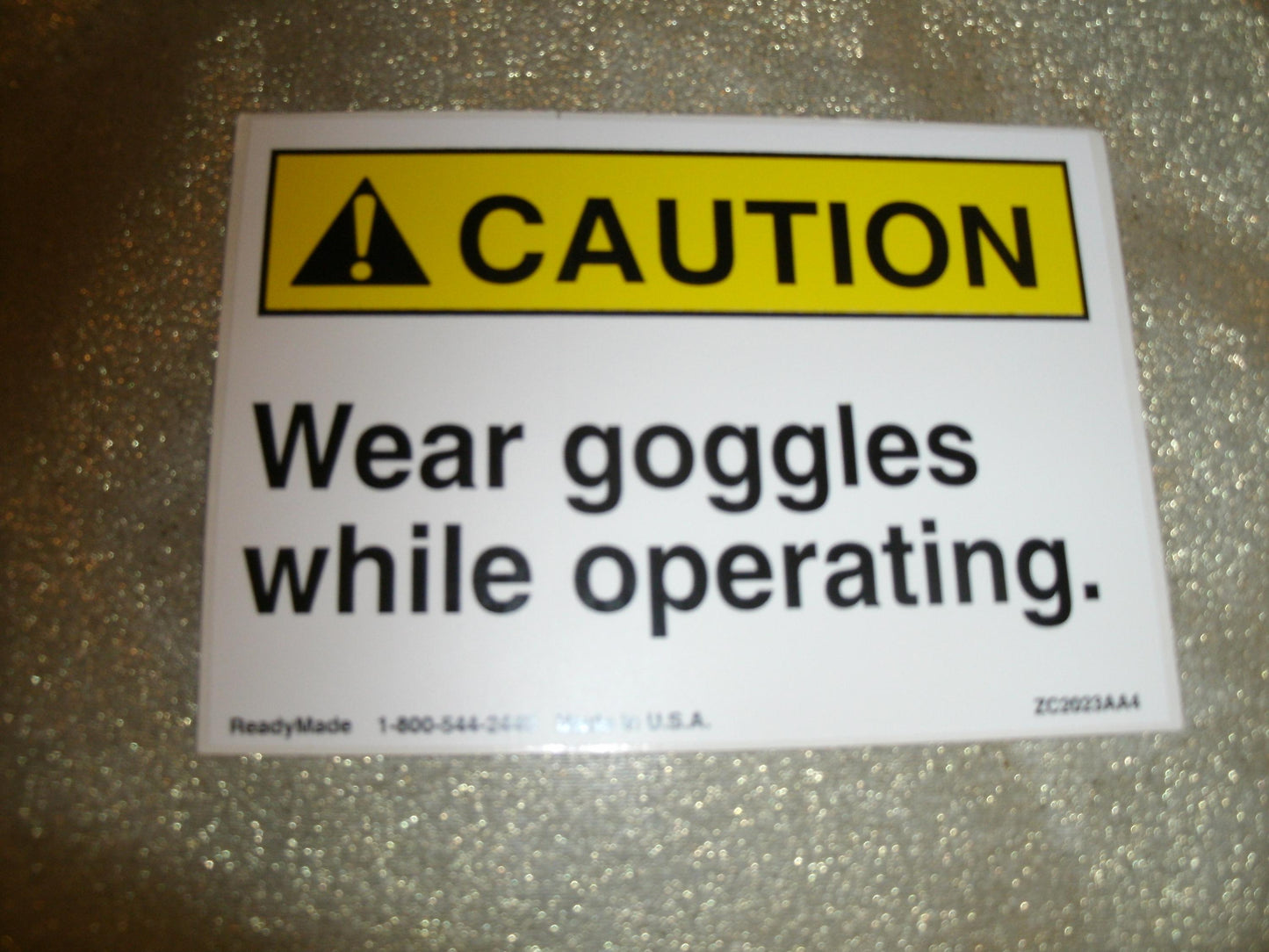 CAUTION Wear Goggles While Operating Sign. New.