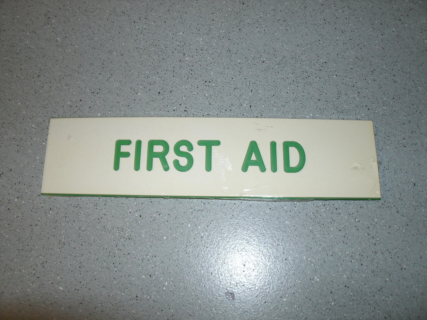 First Aid Engraved Sign. P/N: 834. 2" X 8". Plastic.