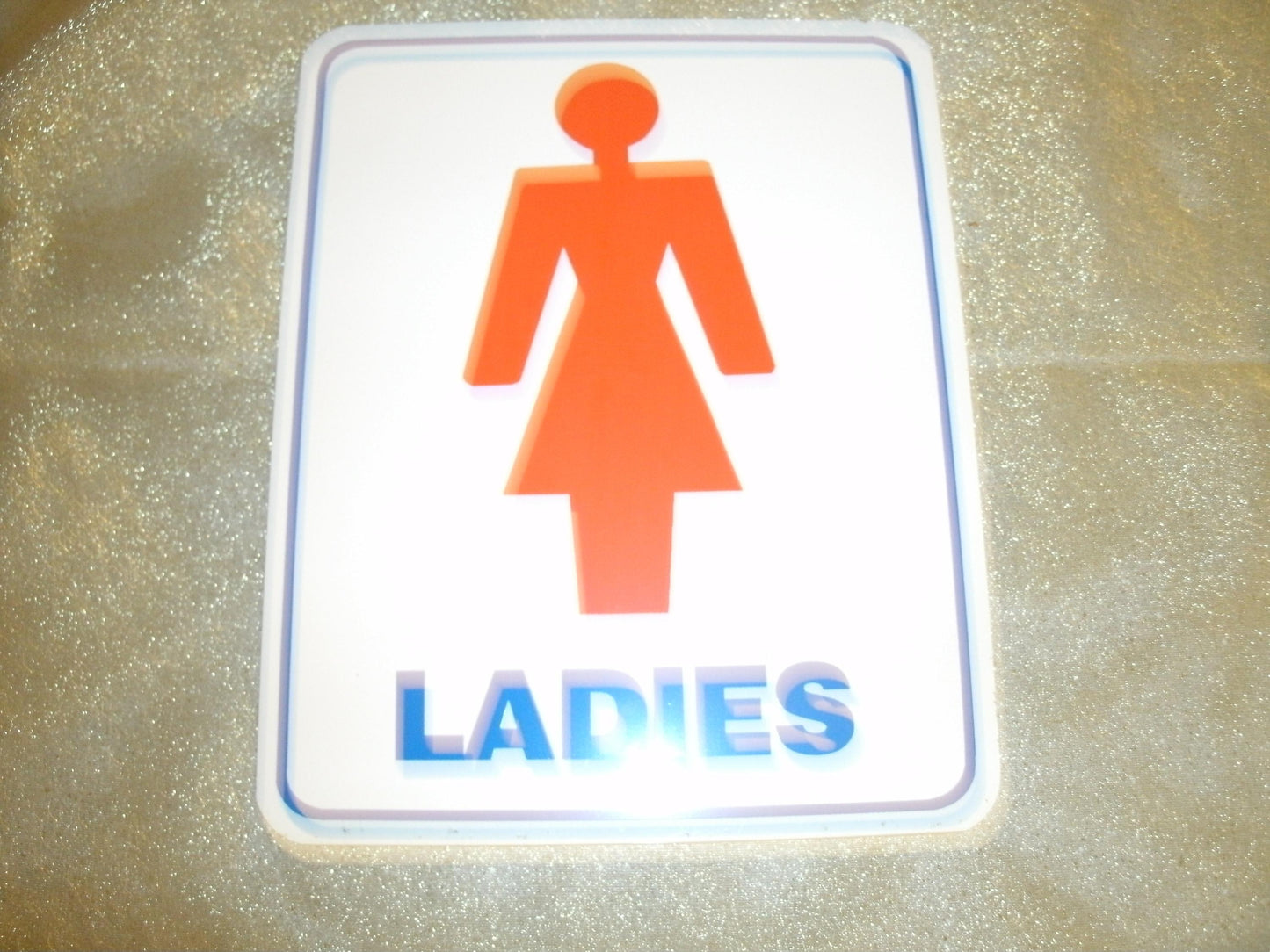 Ladies Bathroom Plastic Sign. Self Stick. New. 6" W X 7 1/2" H.