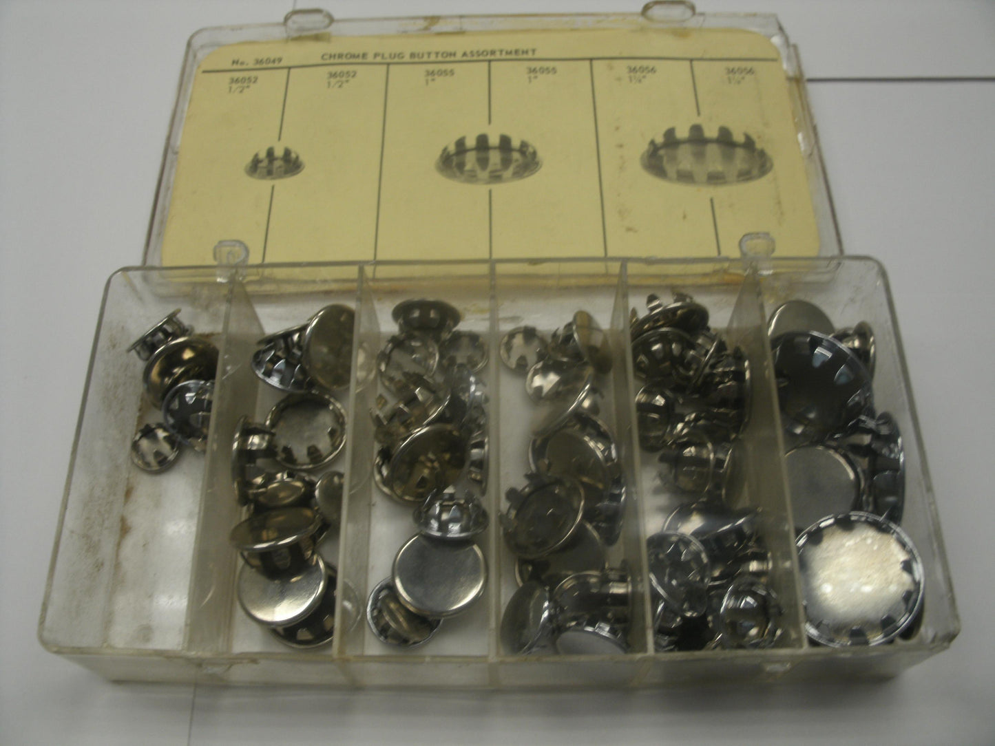 Chrome Plug Buttons Assortment, No. 36049. New.
